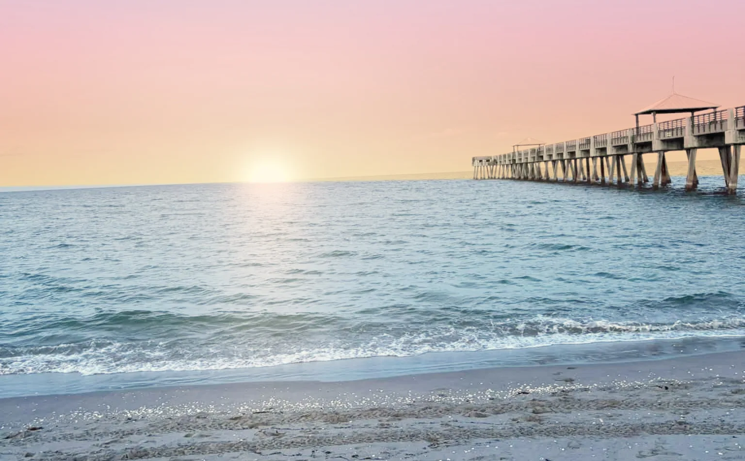 The Juno Beach pier at sunrise